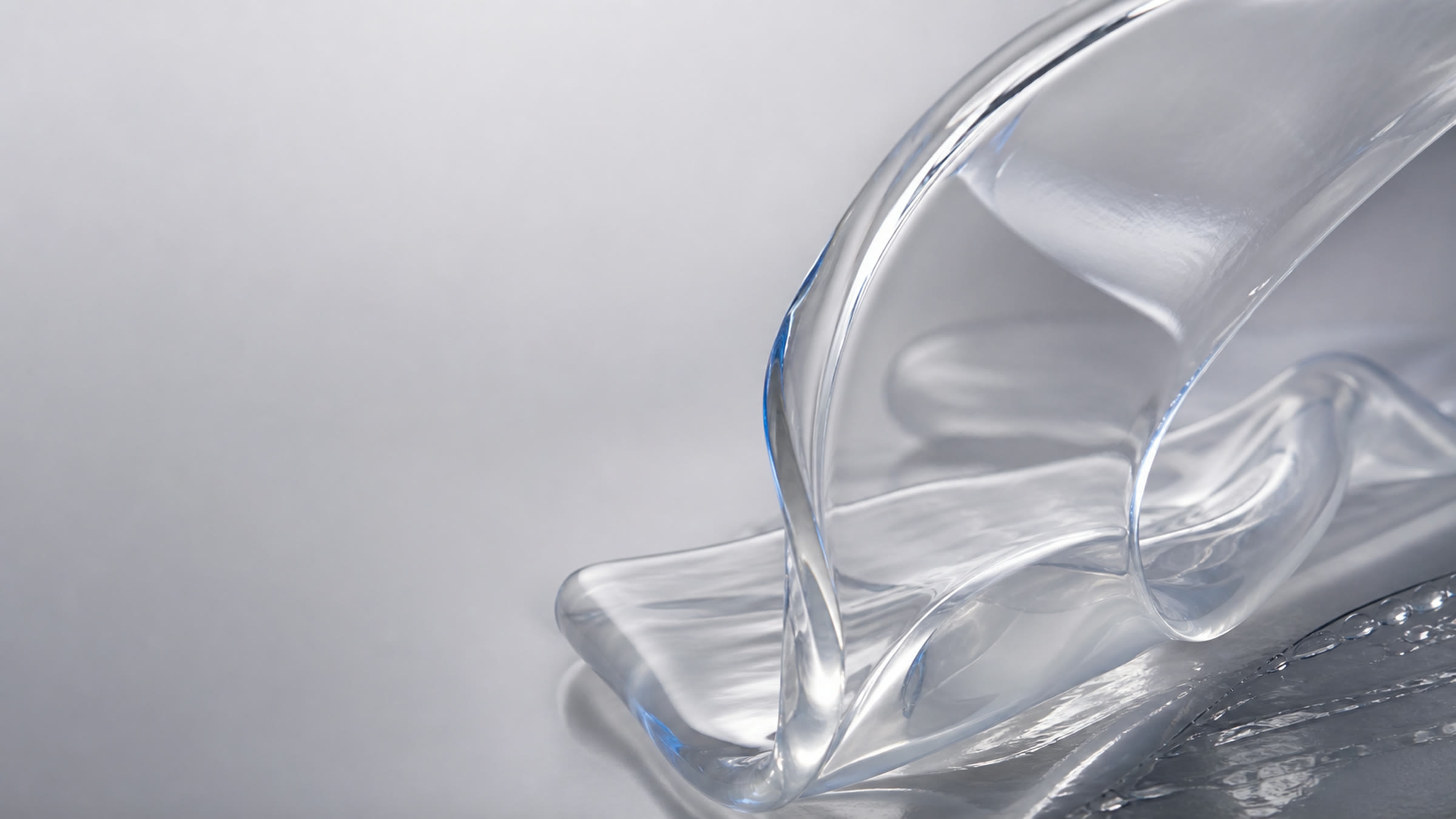 Concept macro view of transparent silicone material forms, not a specific grade or measured result